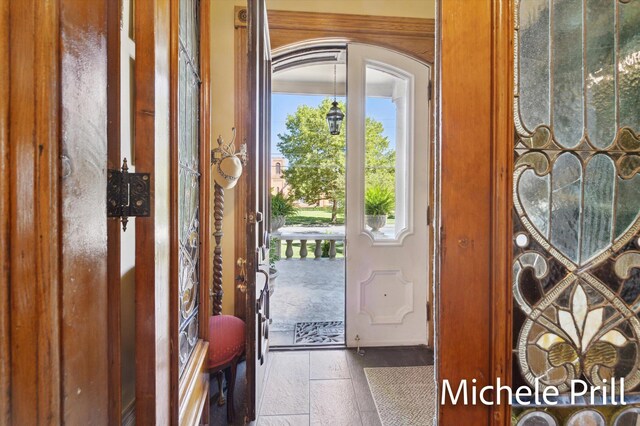 entryway with hardwood / wood-style floors