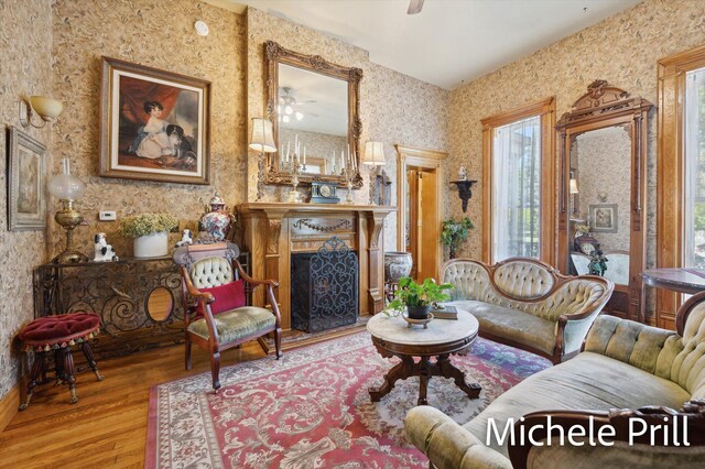 living room with ceiling fan and hardwood / wood-style floors