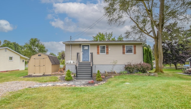 view of front of house with a shed and a front yard