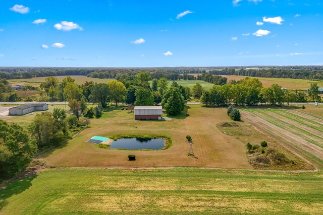 bird's eye view with a water view and a rural view