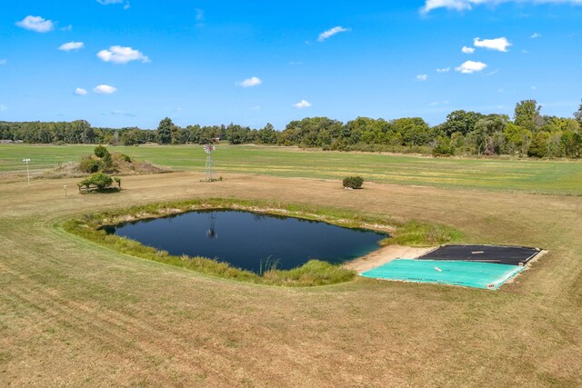 view of property's community featuring a water view and a lawn