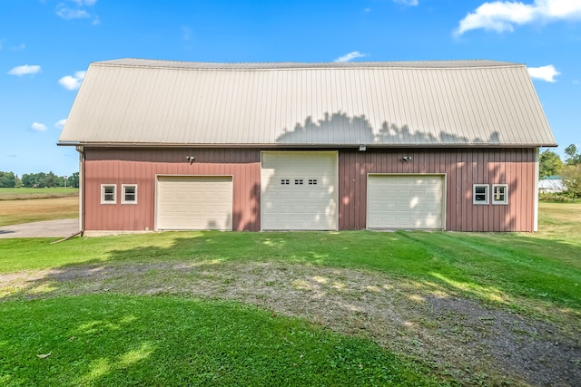 garage with a lawn