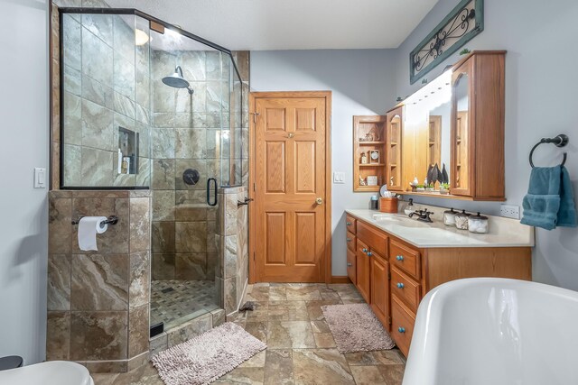 bathroom with vanity and independent shower and bath