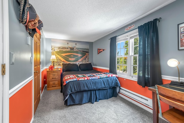 bedroom with a textured ceiling and carpet