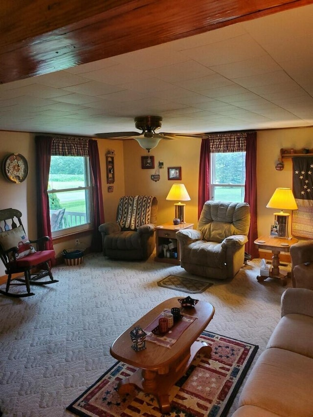 carpeted living room featuring ceiling fan