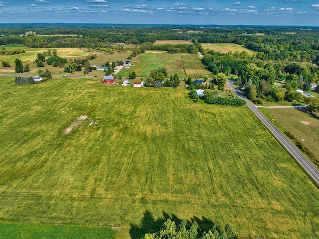 birds eye view of property with a rural view