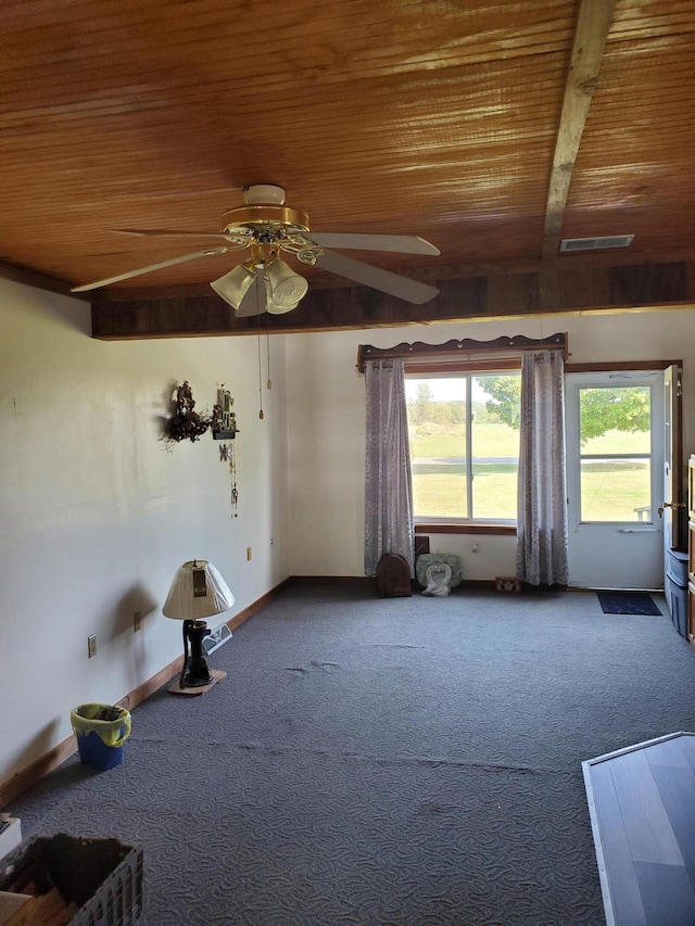 misc room featuring carpet flooring, ceiling fan, beam ceiling, and wooden ceiling