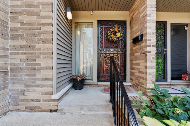 entrance to property with brick siding