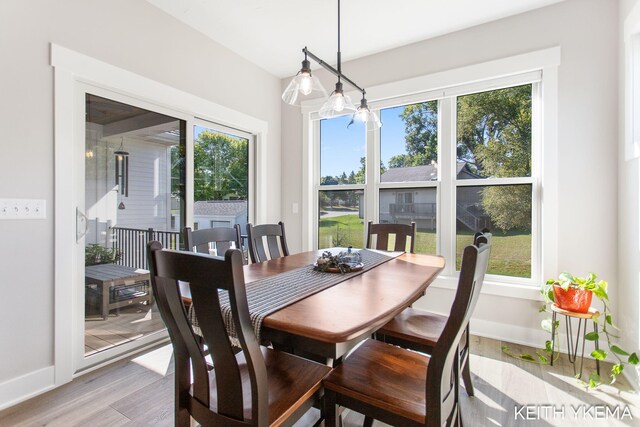 dining area with light wood-type flooring