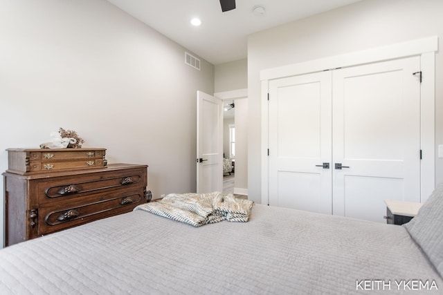 bedroom with ceiling fan and a closet