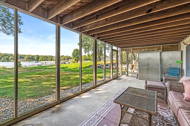 unfurnished sunroom with a water view and a healthy amount of sunlight