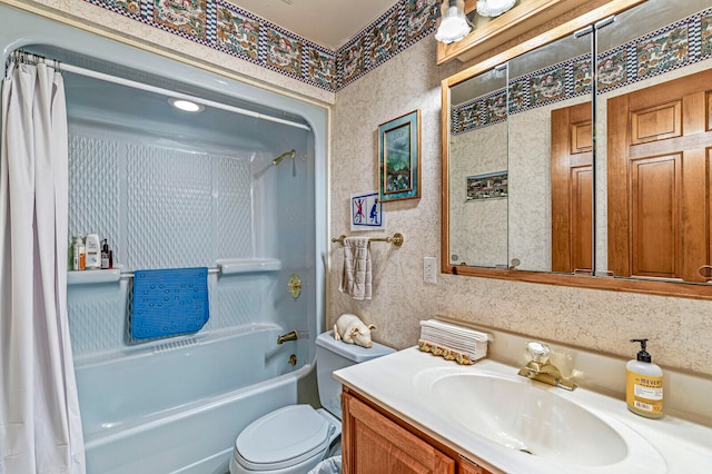 full bathroom featuring shower / bath combo, vanity, and toilet