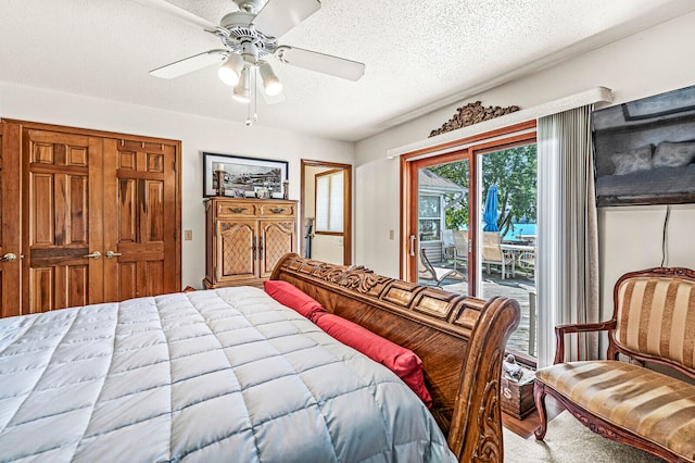 bedroom with a textured ceiling, access to outside, wood-type flooring, and ceiling fan