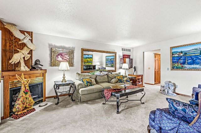 carpeted living room featuring a textured ceiling