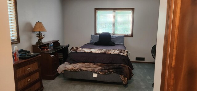 bedroom featuring carpet flooring, baseboards, and visible vents