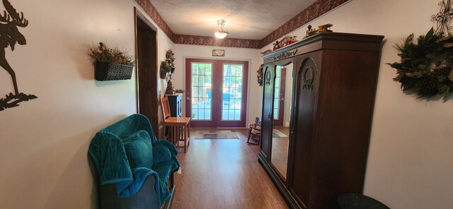 doorway featuring french doors and hardwood / wood-style floors