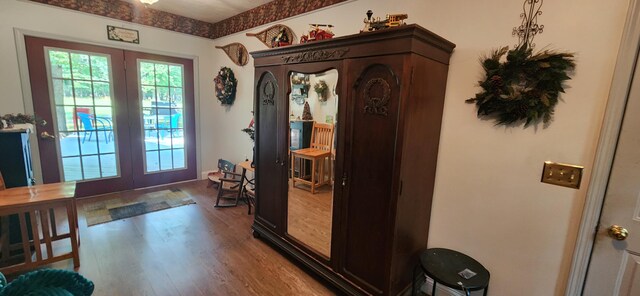 entryway featuring french doors and hardwood / wood-style flooring