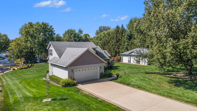 view of front facade with a garage and a front lawn