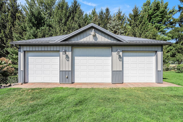 garage featuring a yard