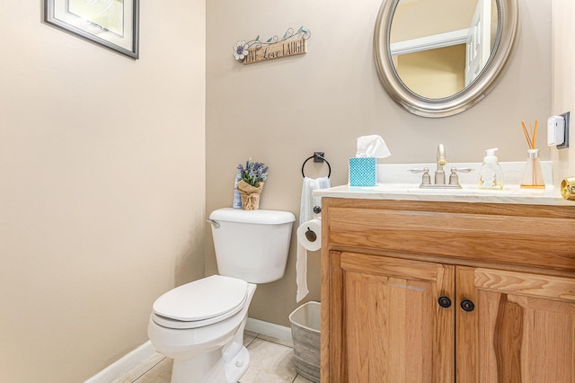 bathroom featuring tile patterned floors, toilet, and vanity