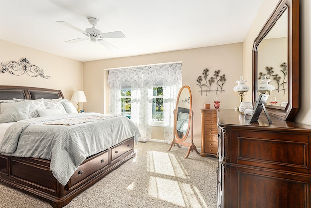 bedroom with ceiling fan and light colored carpet