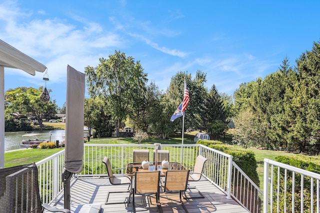 deck featuring a water view and a yard