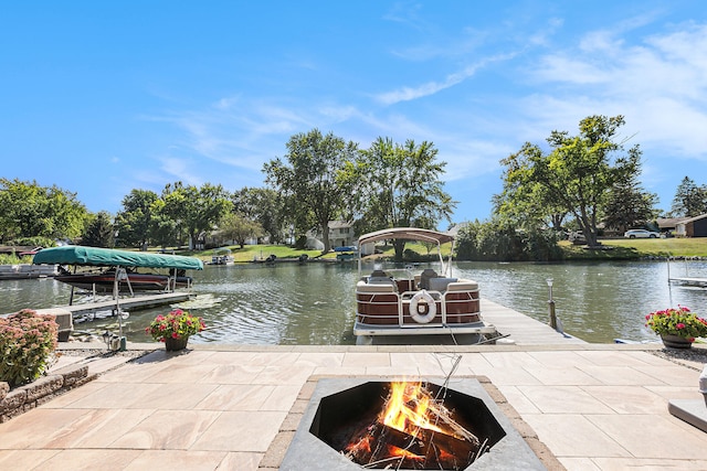 view of dock featuring a water view and an outdoor fire pit