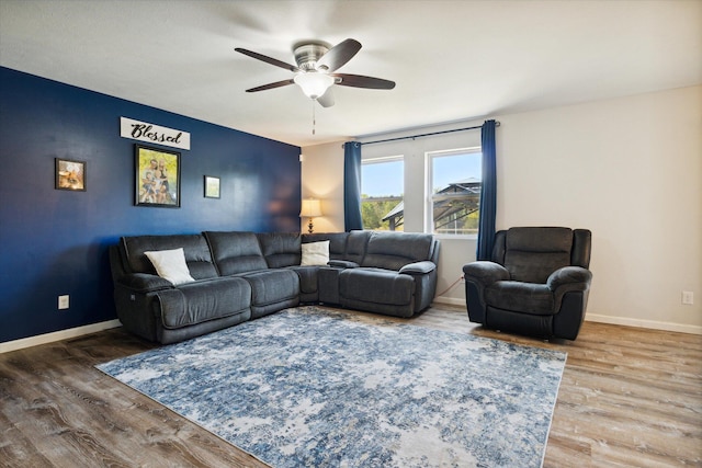 living room with ceiling fan and hardwood / wood-style floors