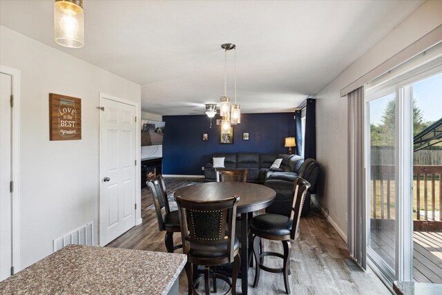 dining room featuring ceiling fan and hardwood / wood-style flooring