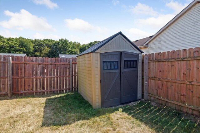 view of outbuilding featuring a yard