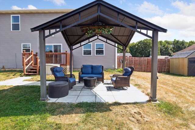 view of patio with a gazebo, a storage unit, and an outdoor hangout area