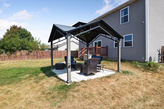 view of yard with a gazebo, outdoor lounge area, and a patio