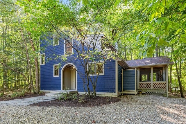 view of front of house featuring a sunroom