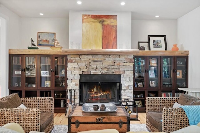 living room featuring hardwood / wood-style floors and a fireplace