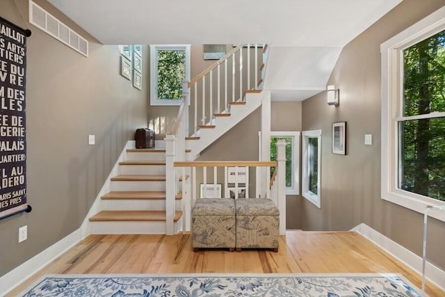 staircase featuring wood-type flooring