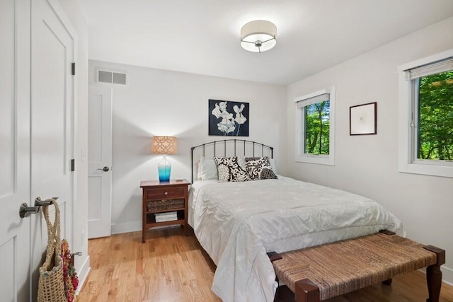 bedroom with light hardwood / wood-style flooring