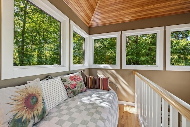 sunroom / solarium with wooden ceiling and lofted ceiling