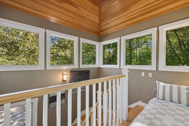 sunroom featuring wooden ceiling