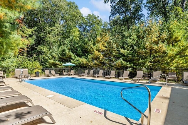 view of swimming pool featuring a patio