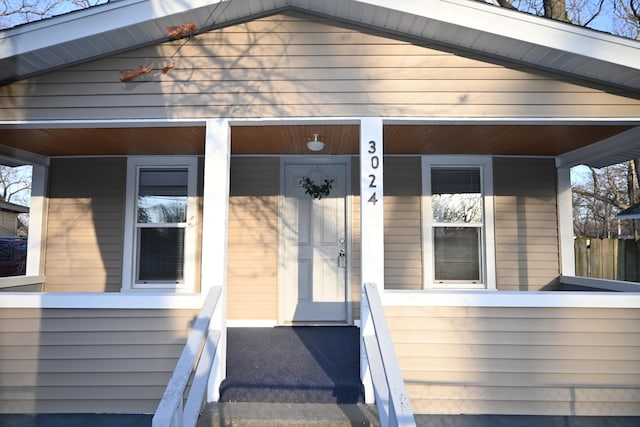 doorway to property with a porch