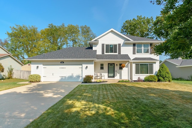 front facade with a front lawn, a porch, and a garage