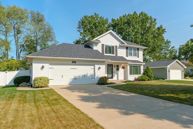 view of front of property with a front lawn and a garage