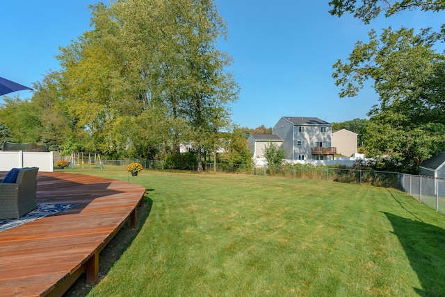 view of yard with a wooden deck