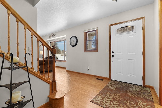 foyer with light wood-type flooring