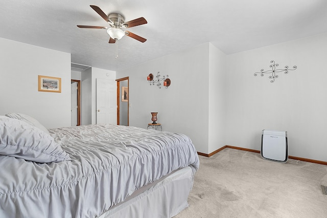 bedroom with ceiling fan and light colored carpet