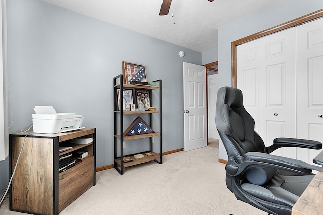 carpeted office with ceiling fan