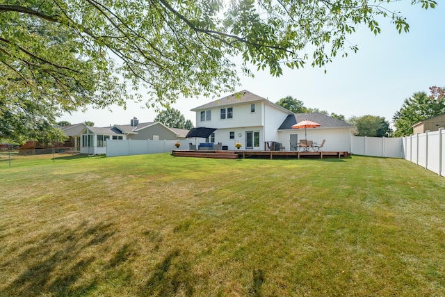 view of yard with a wooden deck