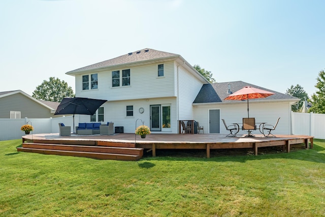 back of property featuring an outdoor hangout area, a deck, and a lawn