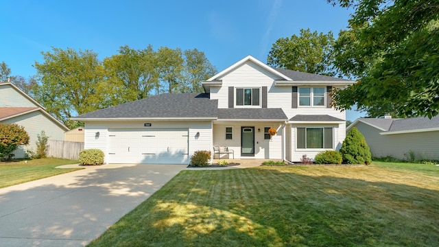 view of front property with a front yard, a porch, and a garage