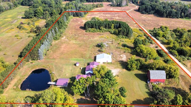 birds eye view of property with a water view and a rural view